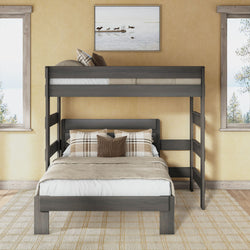 Twin-over-full bunk bed in gray wood finish with ladder and guardrail, full lower bed dressed in neutral linens and plaid pillows in a sunlit modern rustic bedroom