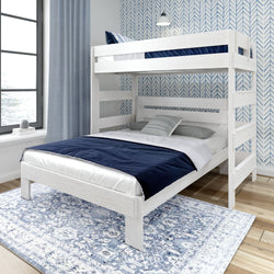 White wooden bunk bed with blue and white bedding in a modern bedroom with a geometric wallpaper background.