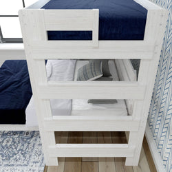 White wooden bunk bed with blue bedding and decorative pillows in a modern bedroom setting.