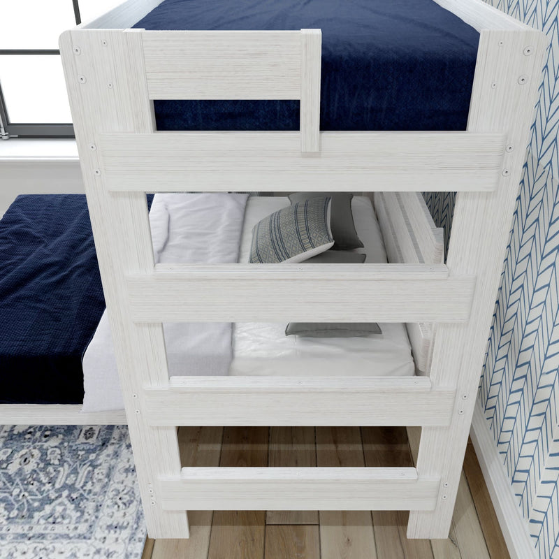 White wooden bunk bed with blue bedding and decorative pillows in a modern bedroom setting.