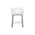 Minimalist white wooden side table with open shelf and tapered legs for modern home décor.