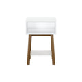 Modern white and wood nightstand with open storage shelf.