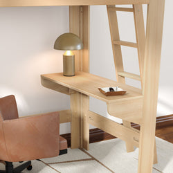 Light wood loft bed with built-in desk and ladder, cozy study nook featuring a gold table lamp, tan leather swivel chair and key tray