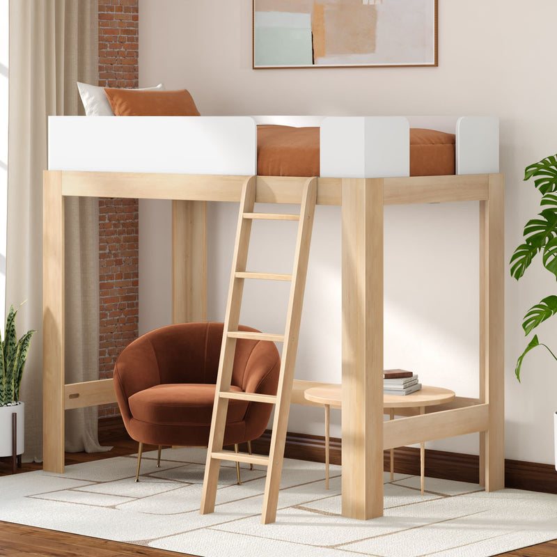 Light wood loft bed with ladder over a cozy reading nook featuring a brown velvet armchair, round side table, potted plants and minimalist modern bedroom decor