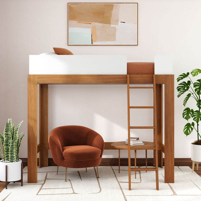Space-saving modern wooden loft bed with ladder above cozy nook featuring rust velvet armchair, round side table, indoor plants and abstract wall art