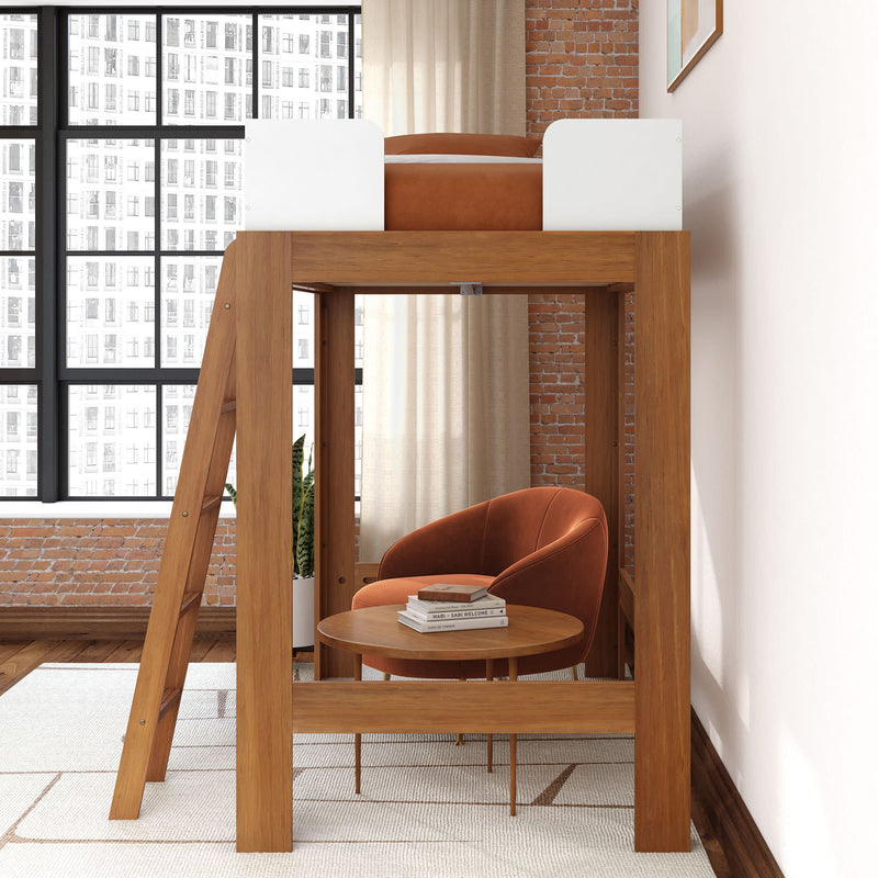 Wooden loft bed with ladder above a cozy reading nook featuring an orange velvet armchair, round wooden side table with books, exposed brick wall and large industrial window, modern space-saving loft bedroom