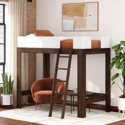 Walnut wooden loft bed with ladder and white safety rails over cozy seating area, modern small-space bedroom with rust-orange armchair, potted plants and abstract wall art