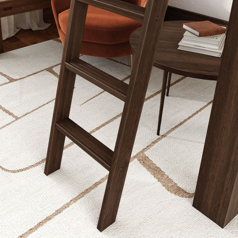 Close-up of dark walnut ladder leg in a mid-century modern living room on a white geometric area rug with a rust orange accent chair and round wooden side table with stacked books