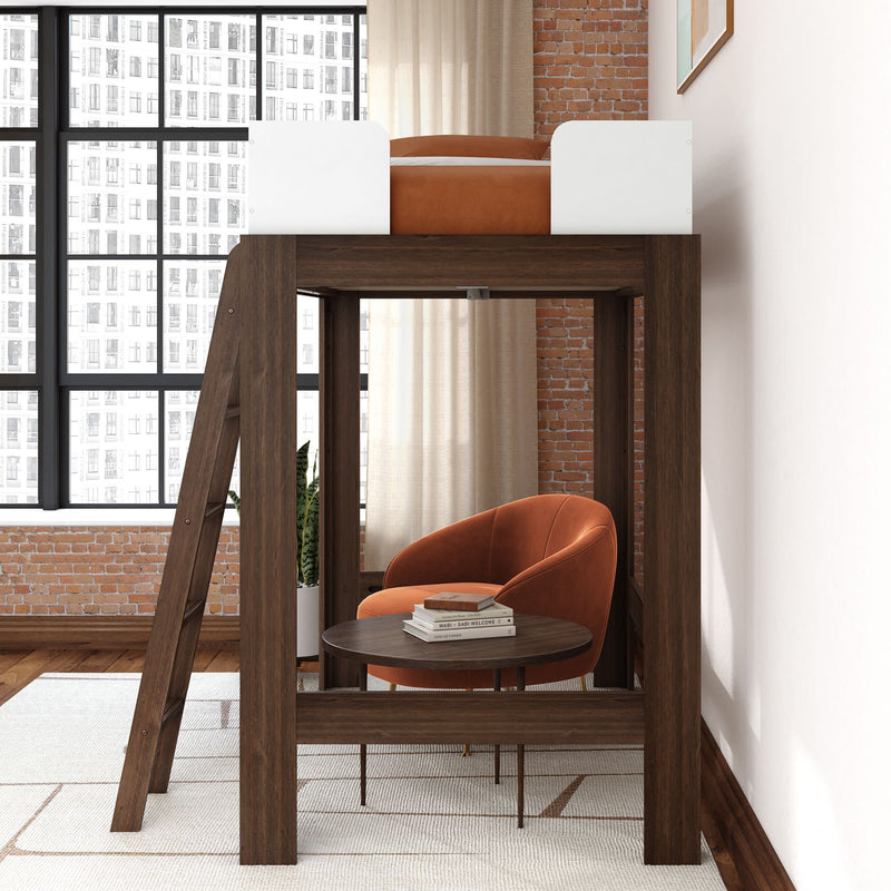 Modern dark-wood loft bed with ladder and under-bed lounge featuring an orange accent armchair, round coffee table with books, floor-to-ceiling grid windows and exposed brick wall — industrial bedroom furniture and space-saving small-space design