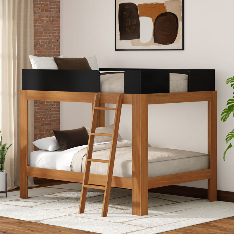 Wooden loft bunk bed with ladder and black guardrails in modern bedroom with exposed brick accent wall and neutral bedding
