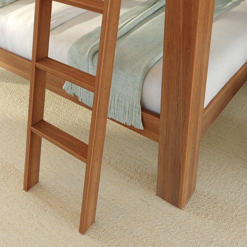 Wooden bunk bed ladder with beige carpet and green blanket.