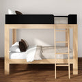 Wooden loft-style bunk bed with ladder, natural wood frame, neutral beige bedding and brown accent pillows on hardwood floor
