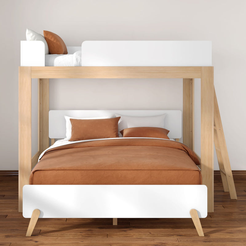 Modern wooden bunk bed with double lower bed and single upper bed, brown duvet and pillows, white headboards and ladder in a minimalist Scandinavian bedroom on hardwood floor