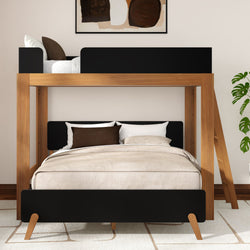 Modern wooden loft bunk bed twin-over-full with black accents, beige bedding, ladder and potted plant in a minimalist bedroom