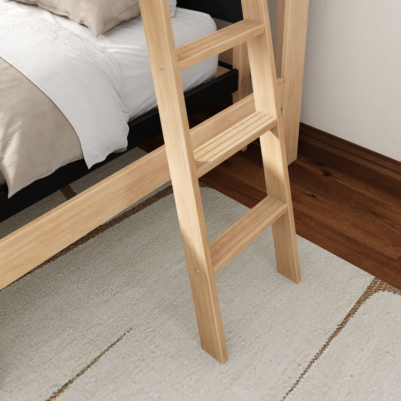 Close-up of a natural wood bunk bed ladder beside a neatly made bed, resting on a beige area rug over dark hardwood flooring
