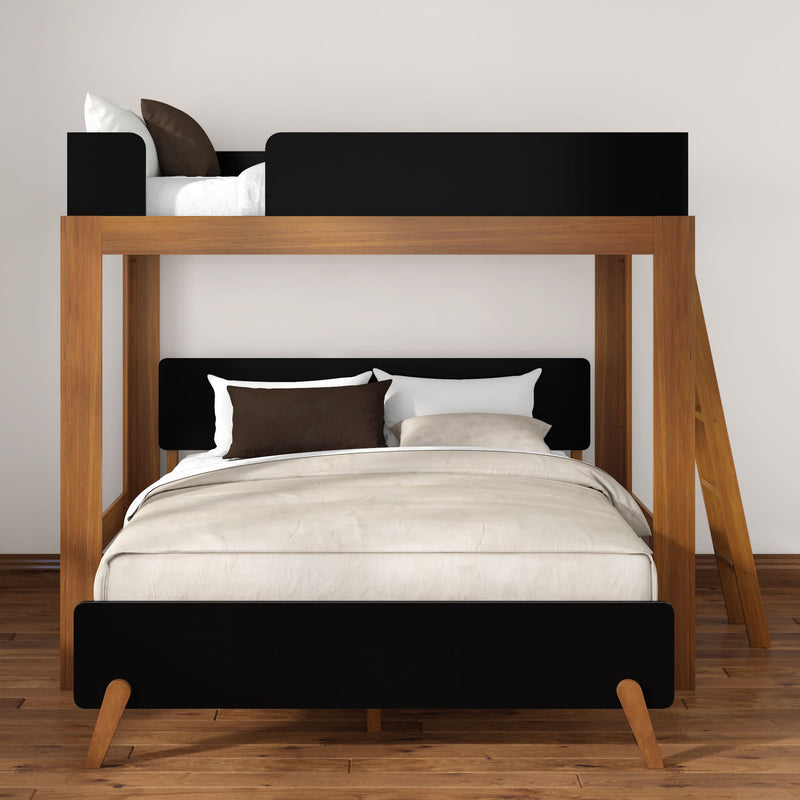 Modern twin-over-full wooden bunk bed with black accents, neutral beige bedding and pillows, ladder on hardwood floor in minimalist bedroom