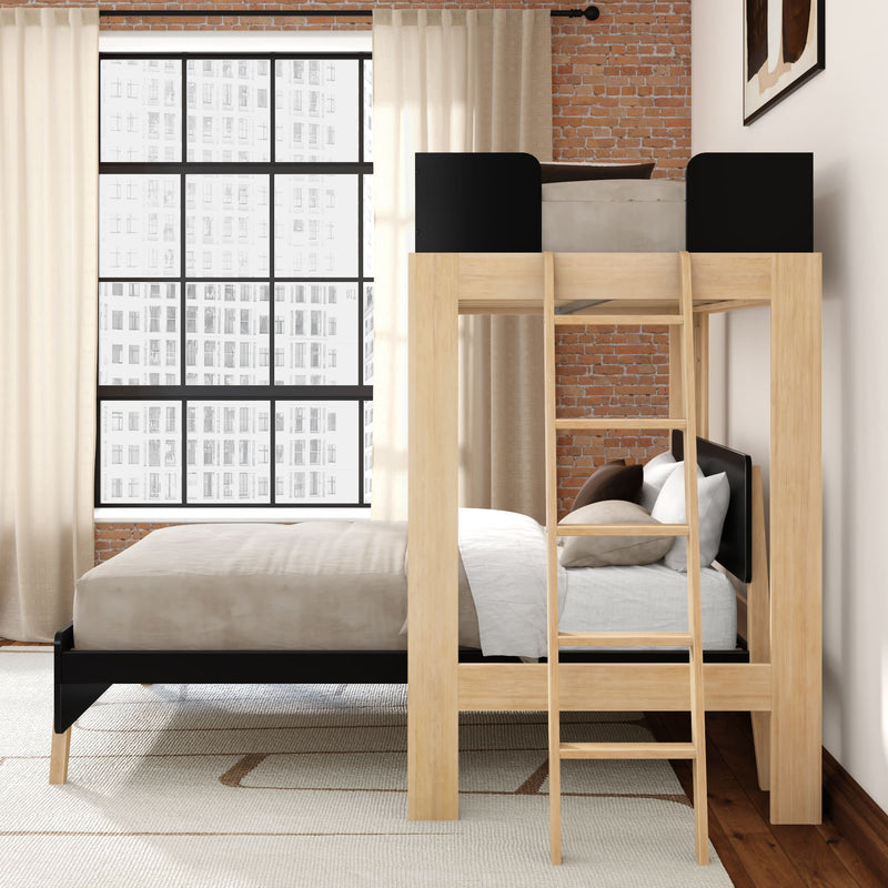 Wooden loft bunk bed with ladder and lower full bed in modern industrial bedroom with exposed brick wall, large grid window and neutral bedding
