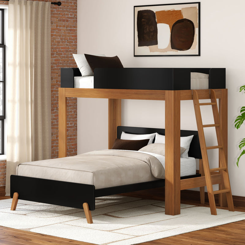 Modern wooden twin-over-full bunk bed with ladder and black accents in a bright contemporary bedroom with exposed brick wall, neutral bedding, and area rug