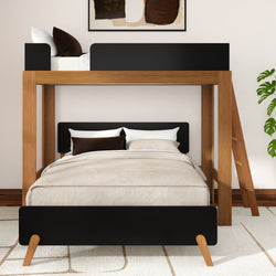 Modern wood loft bunk bed with black accents, beige bedding and ladder in a minimalist bedroom with framed art and potted plant