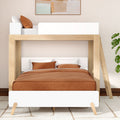 Modern wooden loft bunk bed (twin-over-full) with rust-brown bedding, white headboards, ladder and minimalist bedroom decor with potted plant