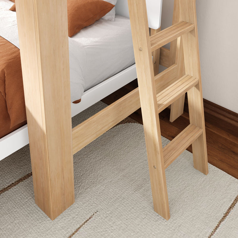 Light natural wood bunk bed ladder beside a white mattress with rust-colored bedding on hardwood floor and beige woven area rug