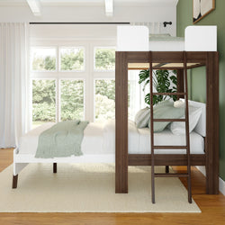 Modern loft bed with wooden frame and stylish green accents in a bright, minimalist bedroom.