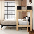 Modern wooden loft bunk bed with ladder, beige neutral bedding and black accents in an industrial bedroom with exposed brick wall and large grid window