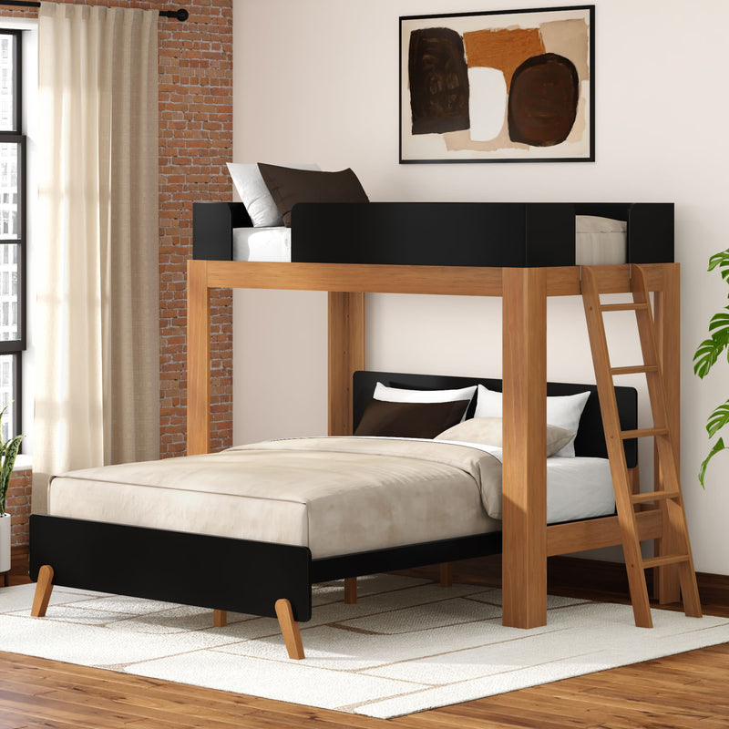 Modern wooden loft bunk bed with full-size lower bed and twin upper bed, black accents and ladder, neutral bedding in a stylish bedroom with brick accent wall and large window