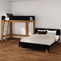 Modern minimalist bedroom featuring a wooden loft bed with ladder and black accents above a platform bed, neutral bedding on hardwood floor