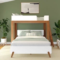 Stylish modern bedroom with wooden loft bed and green decor.