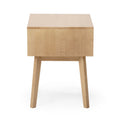 Front view of a minimalist natural wood side table with square top and tapered legs on white background