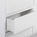 White wooden dresser with an open drawer showcasing minimalist modern design.