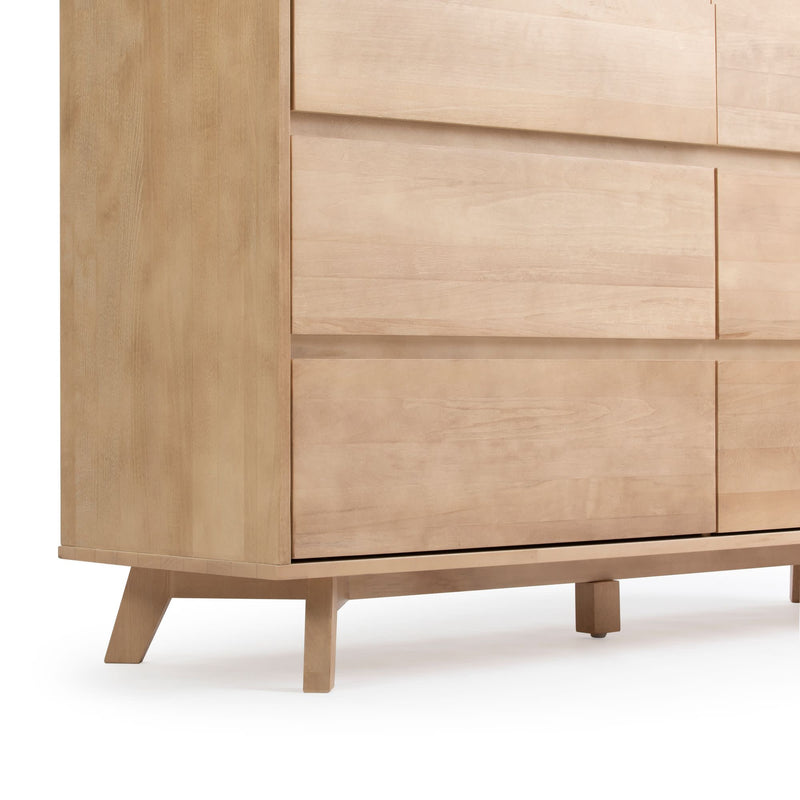 Modern wooden dresser with sleek drawers and minimalist design.