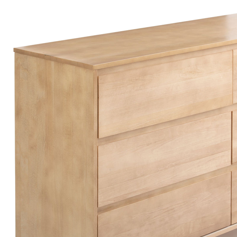 Light wood modern dresser with three spacious drawers.