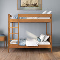 Modern solid wood bunk bed with ladder, blue and white bedding and decorative pillows in a minimalist coastal-style bedroom