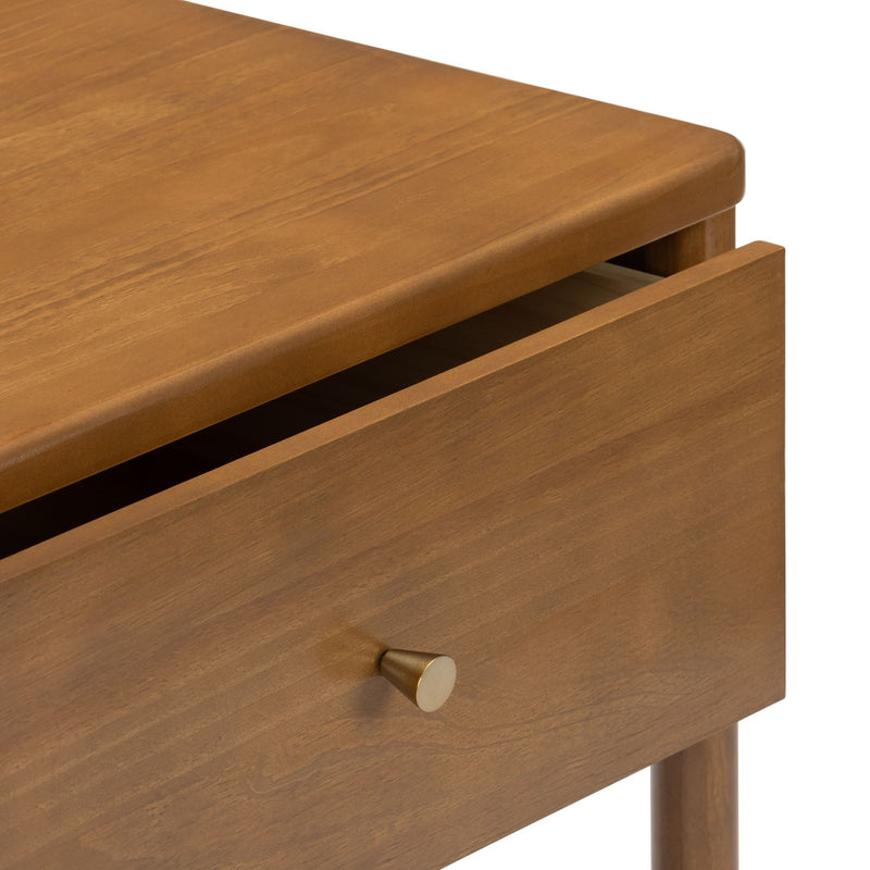 Mid-century modern wood nightstand drawer in warm walnut finish with round brass knob and tapered leg detail