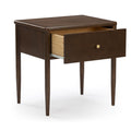 Mid-century modern dark walnut wooden nightstand bedside table with single open drawer, brass knob and tapered legs on white background