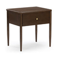 Dark brown solid wood mid-century modern nightstand/end table with single drawer, round brass knob and tapered legs on white background