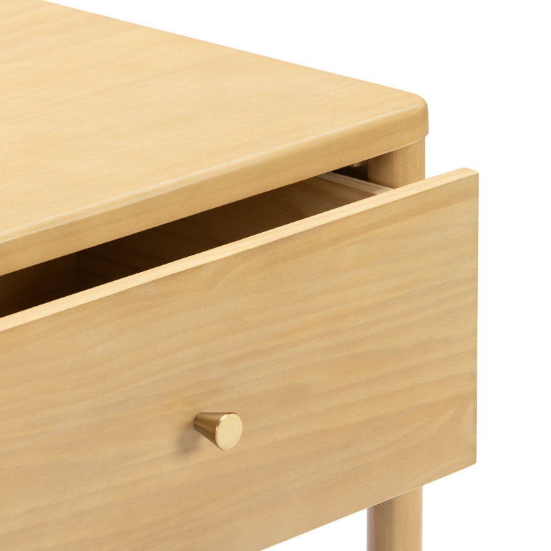 Minimalist light wood nightstand with partially open drawer, rounded top edge and brass knob