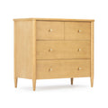 Light maple mid-century modern four-drawer dresser with round brass knobs, tapered legs and natural wood finish for bedroom storage