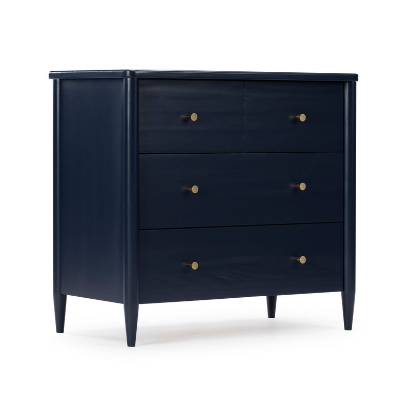 Navy blue wooden dresser with brass knob hardware, tapered mid-century legs and modern bedroom chest design