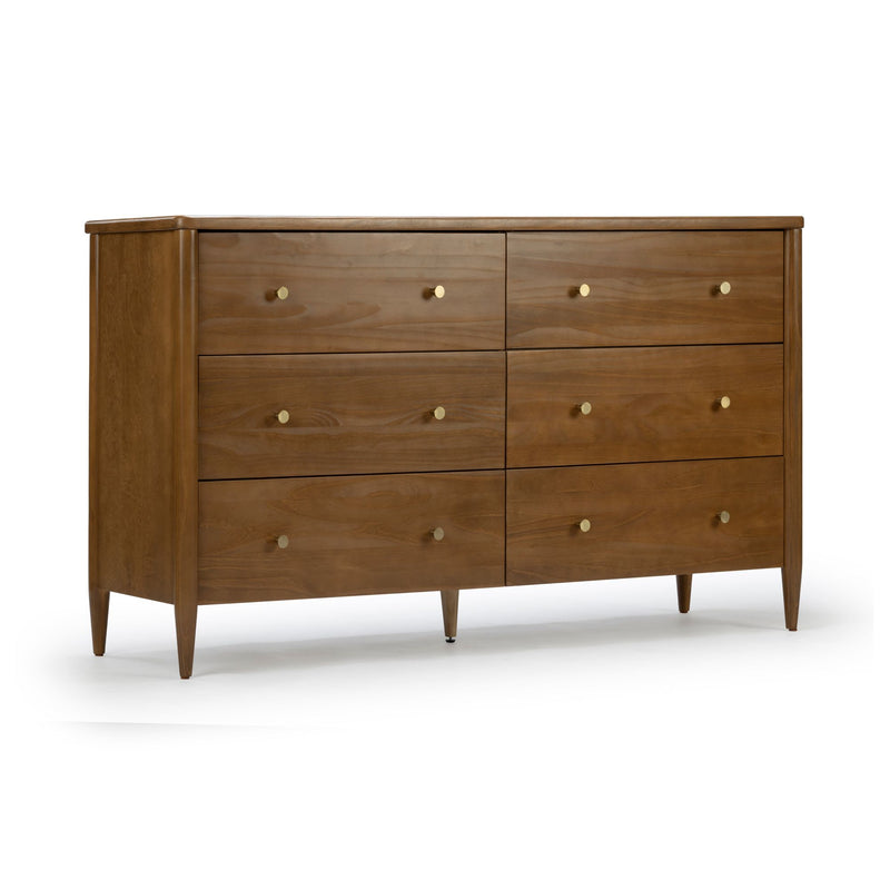 Mid-century modern six-drawer walnut dresser with brass knobs and tapered legs on white background