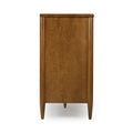 Back view of mid-century modern walnut wooden dresser with tapered legs, visible wood grain panel and adjustable leveling foot