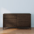 Mid-century modern dark walnut 6-drawer dresser with brass knob hardware on hardwood floor, bedroom storage furniture