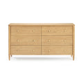 Natural maple six-drawer dresser with round brass knobs and tapered legs on white background — mid-century modern wooden bedroom storage chest