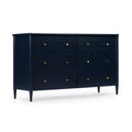 Navy blue mid-century modern wooden dresser with six drawers, round brass knobs, tapered legs and visible wood grain for bedroom storage