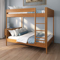 Modern solid wood bunk bed with ladder in a cozy bedroom, white and blue bedding, decorative pillows and hardwood floor