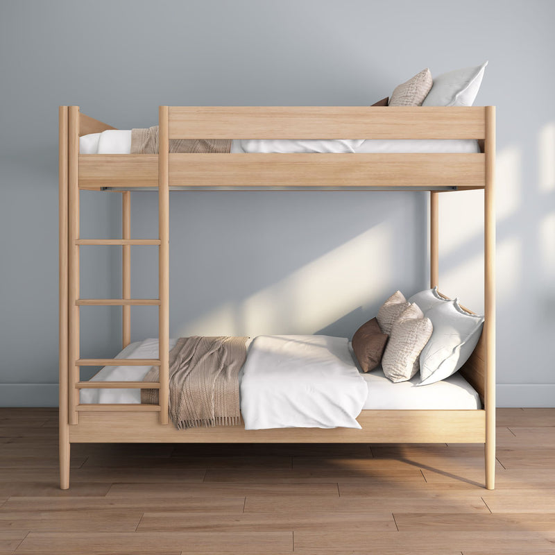 Natural oak twin-over-twin wooden bunk bed with ladder and neutral bedding in a minimalist Scandinavian-style bedroom