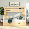 Natural wood bunk bed with green bedding and under-bed storage in a modern kids' bedroom with cityscape wall art and potted plant