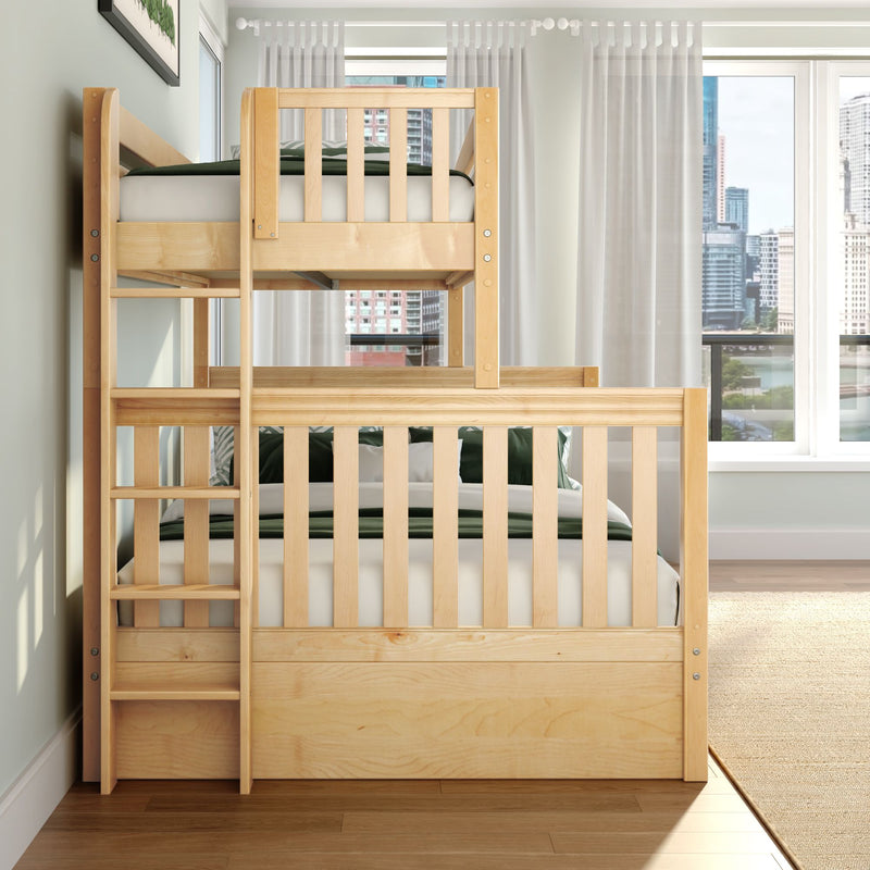 Solid wood twin-over-twin bunk bed with ladder and natural pine finish in bright modern kids' bedroom, green bedding, sheer curtains and city skyline window view